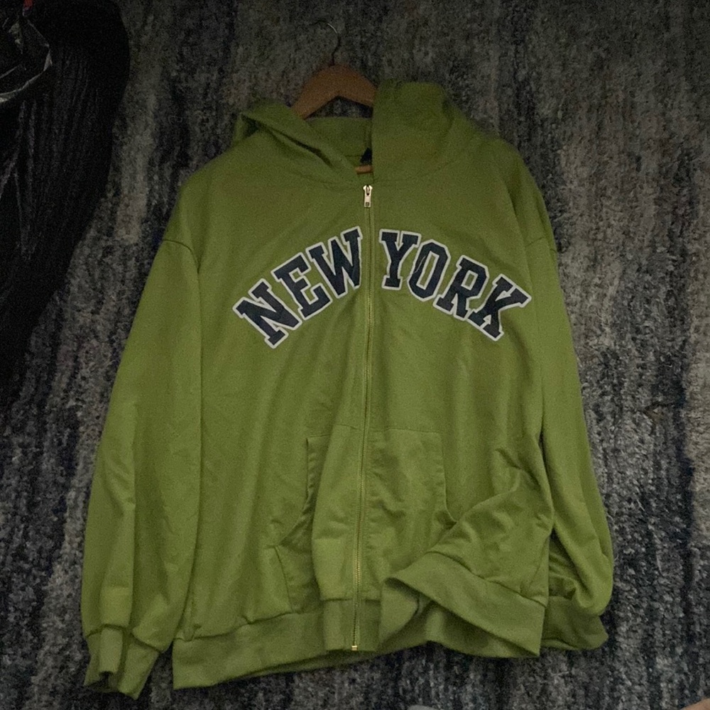 This is a green graphic sweatshirt from SHEIN.